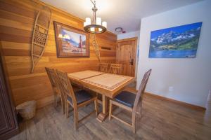 a dining room with a wooden table and chairs at Montezuma 1770 by SummitCove Lodging in Colorado in Keystone +47 photos