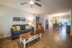 a living room with a couch and a table at Scottsdale Miller in Scottsdale
