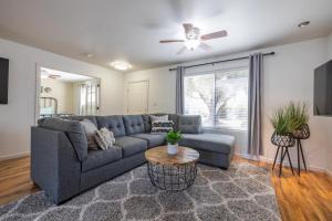 a living room with a couch and a table at Scottsdale Orange Blossom in Scottsdale
