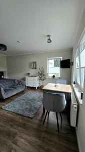 a living room with a table and a couch at Ferienwohnung Pollig in Rech