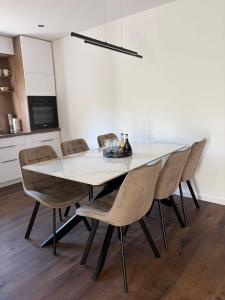 a dining room with a table and chairs at Apartman Tomislav in Slavonski Brod