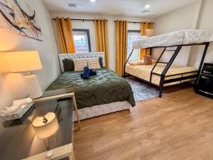 a bedroom with two bunk beds and a desk at BP STAYS - Hotel-Style, No Host, Professionally Managed ID312 in Jersey City