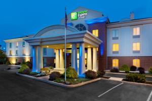 a hotel building with a gazebo in a parking lot at Holiday Inn Express & Suites by IHG Chambersburg by IHG in Chambersburg