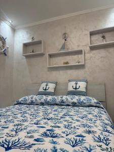 a bedroom with a bed with two pillows on it at Il BORGO in Lapedona