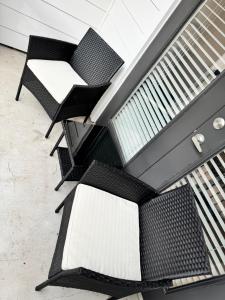a group of chairs sitting on the side of a building at The Experience in Houston +17 photos