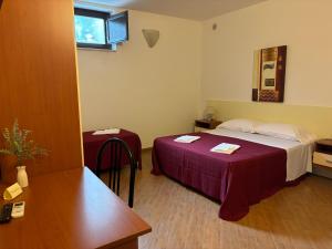 a hotel room with a bed and a table at Bed and Breakfast Tenuta Sicilia in Ostuni +37 photos