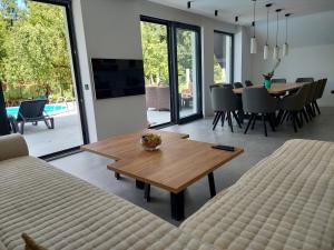 a living room with a couch and a table at Kuca za odmor Moj Mir in Kalesija