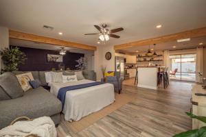 a living room with a couch and a table at Scottsdale Osborn in Scottsdale