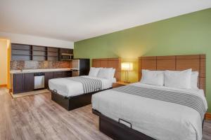 a hotel room with two beds and a kitchen at Best Western Kincardine in Kincardine +76 photos