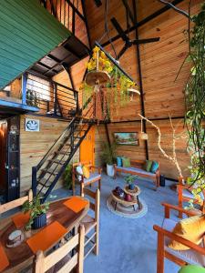 a room with a staircase in a wooden house at Alpine Cabin PR 2026 in Tavera Abajo