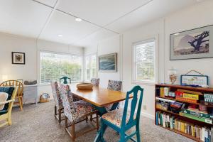 a dining room with a wooden table and chairs at 2nd Tee at Neskowin Village in Neskowin