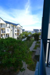 a view from the balcony of a apartment building at Fynbos Lifestyle Estate - One Bed Apartment in Cape Town