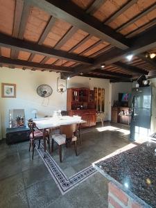 a kitchen with a table and chairs in a room at Casona Veroka in San Pedro +14 photos
