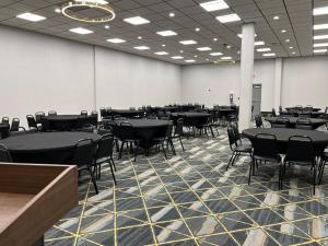 a large room with tables and chairs in it at Holiday Inn Express Big Rapids by IHG in Big Rapids +26 photos