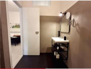 a bathroom with a white sink and a mirror at La Casa di Rinaldo in Catania +75 photos