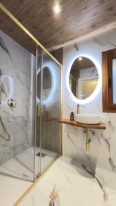 a bathroom with a shower and a sink at River Breeze Douro - Casa Touriga in Marmelal +16 photos