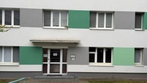 a facade of a building with windows and a door at Rondel in Žilina