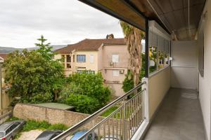 a balcony with a view of a building at Apartmani Andjelka in Tivat