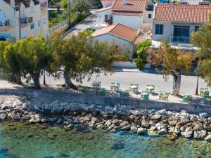 an aerial view of a river with chairs and trees at Olvio Living by the Sea in Sami