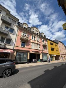 a building on the side of a city street at Leo, apartment in Wasserbillig