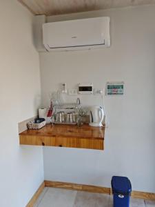 a kitchen counter with a sink in a room at Hospedaje Diente de Leon in Ataliva Roca