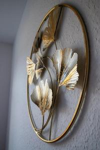 a mirror with a bunch of butterflies on it at Apartement Elsterblick in Gera +48 photos