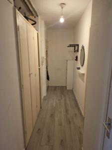 a hallway of a room with a wooden floor at The Hague appartment in The Hague