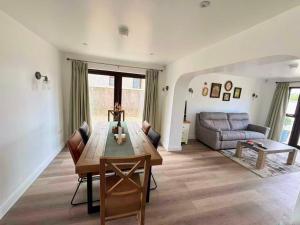 a living room with a table and a couch at Trelawney in Coleraine