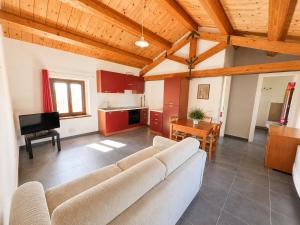 a large living room with a couch and a table at Agriturismo Il Vecchio Scornabecco in Senigallia