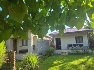 a small white house with a red roof at G&A Friendly stay in Port Vila