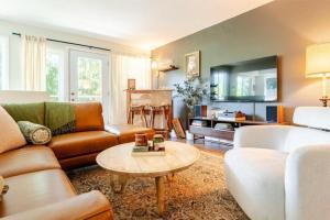 a living room with a couch and a table at Evergreen Escape in Felton