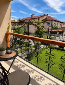 a balcony with a view of a yard at Krisiya's Apartment in Bansko