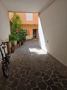 a hallway with a bike parked in a building at Casa Corbatto Family Apartment in Grado in Grado