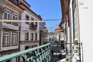 a view of an alley from a balcony at Misericórdia Rooms in Guarda
