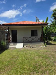 a small house with a red roof at G&A Friendly stay in Port Vila