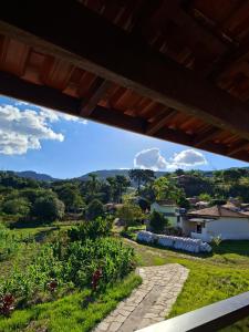 a view from the porch of a house at Recanto das palmeiras 2 in São Thomé das Letras