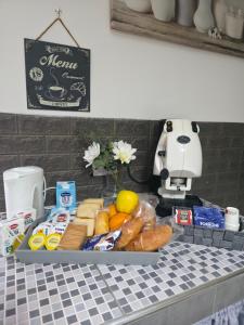 a table with a tray of food on a counter at Casa Quattro Cannelli in Pozzuoli