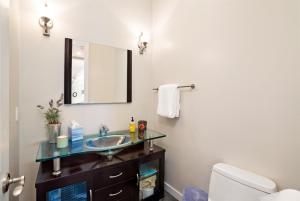 a bathroom with a sink and a mirror at Hilltop Vistas Pool, Wine & Family Fun in Atascadero +67 photos