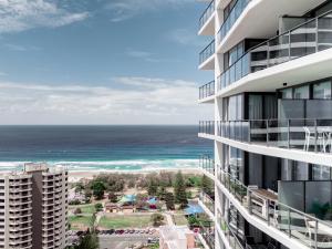 a view of the ocean from the balcony of a building at Modern Broadbeach 2BR Apartment - Pet Friendly in Gold Coast