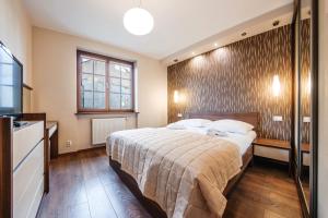 Ένα ή περισσότερα κρεβάτια σε δωμάτιο στο Bulwar Portowy, Sun & Snow