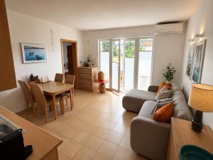 a living room with a couch and a table at Mirca by the Sea in Mirce