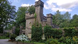 an old castle with ivy growing on it at Summer Salt house in Morecambe