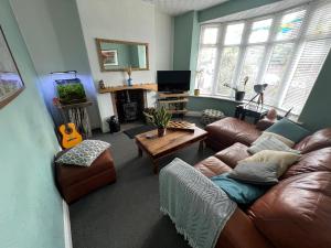 a living room with a couch and a table at Summer Salt house in Morecambe