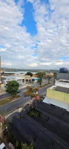 a view of a city with a street and buildings at Paris Flats Lagoa Santa in Lagoa Santa