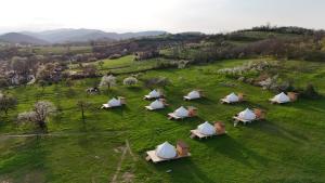an aerial view of a group of tents in a field at Glamping Stolat in Stolat
