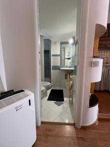 a bathroom with a shower and a toilet in a room at Casa Leon in Sperlonga +30 photos