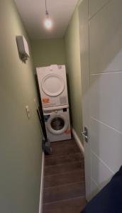 a small bathroom with a toilet in a room at Sperrin Way Apartment in Newtownstewart