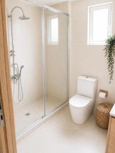 a bathroom with a shower and a toilet at Panorama View in Kalamata +7 photos