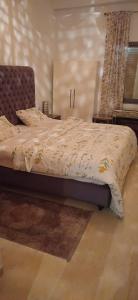 a bed in a bedroom with at Ville n4 in Sidi Daoud
