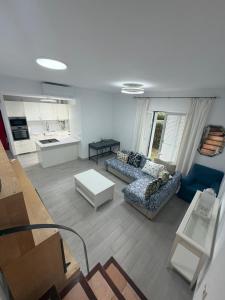 a living room with a couch and a table at Galia costa ballena 2 in Cádiz